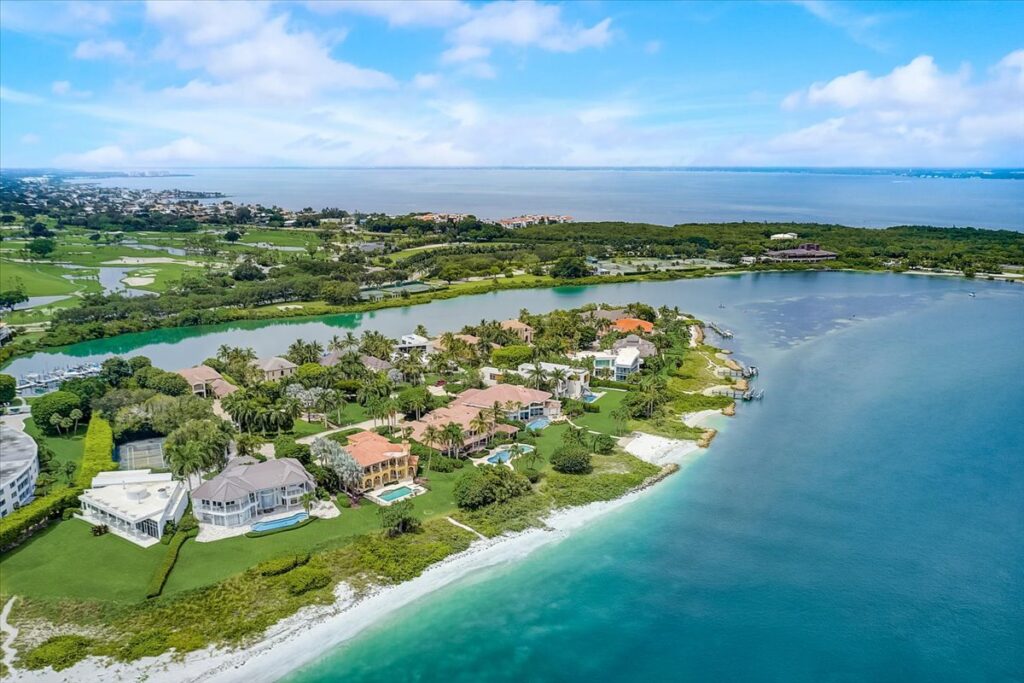 Aerial view of Lighthouse point with beautiful blue waters surrounding the cove.